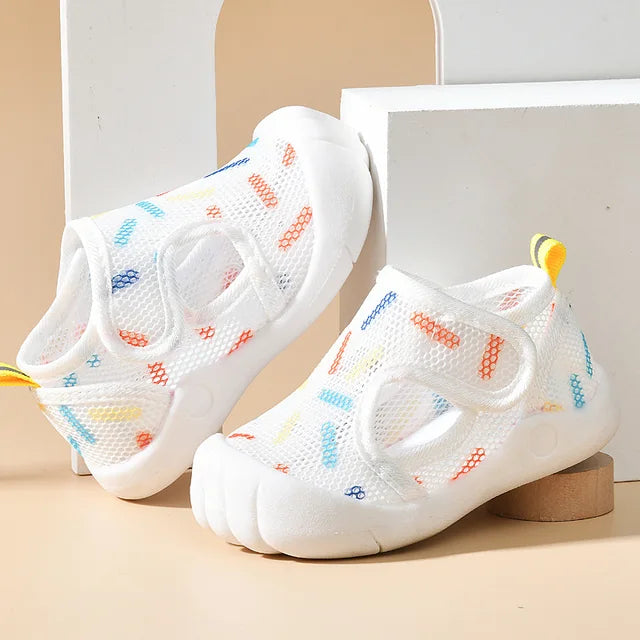 White mesh sandals with colorful dash prints, white toe caps and yellow heel loops
