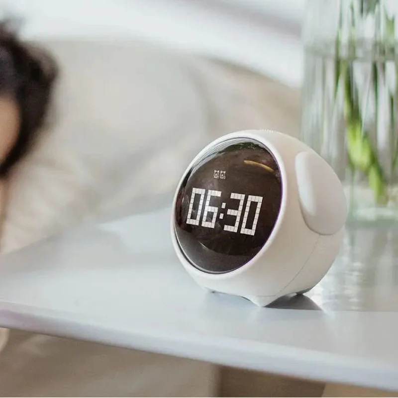 White digital alarm clock displaying 08:30 on a bedside table