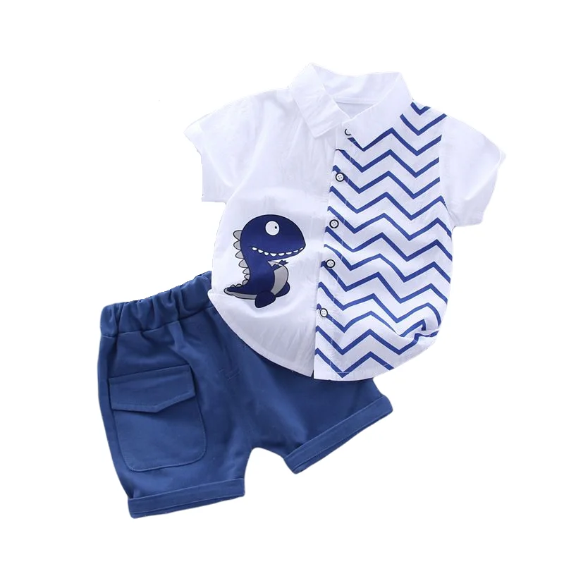 White dinosaur shirt with a blue zigzag panel and coordinating blue shorts
