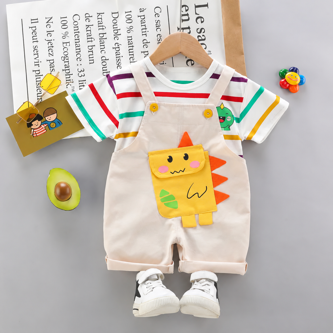White short overalls with a yellow dinosaur applique and a multicolor striped short-sleeve shirt