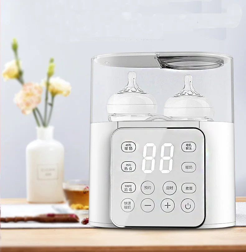 White bottle warmer holding two bottles on a countertop, with a digital control panel.