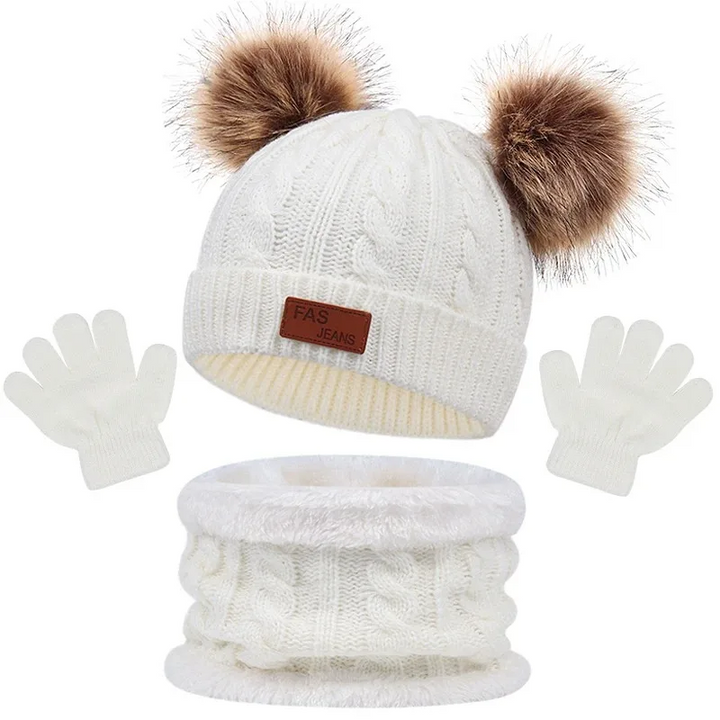 White cable-knit winter set with a double-pom-pom hat, loop scarf, and gloves