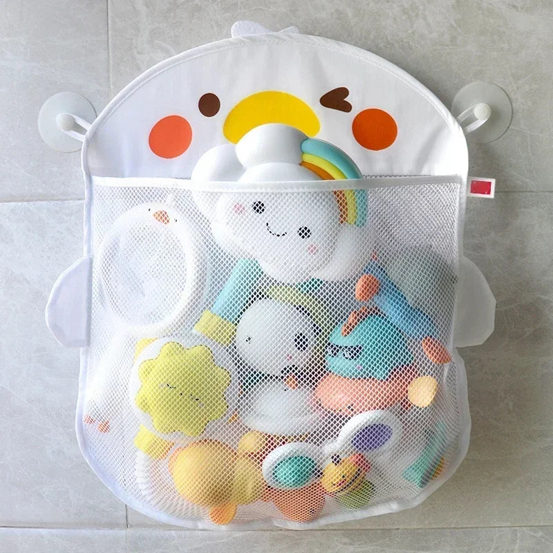 White duck mesh bath toy organizer hanging on tile with colorful toys inside