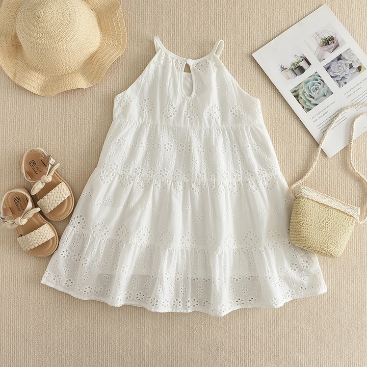 White eyelet dress back view showing the neckline opening and tiered skirt