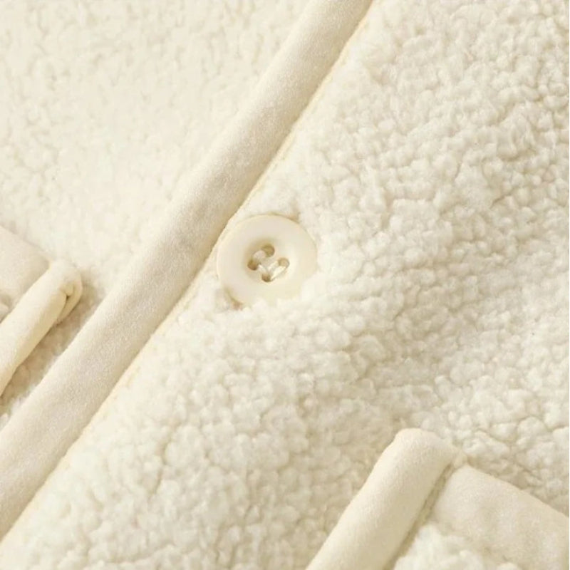 Close-up of a white fleece vest&