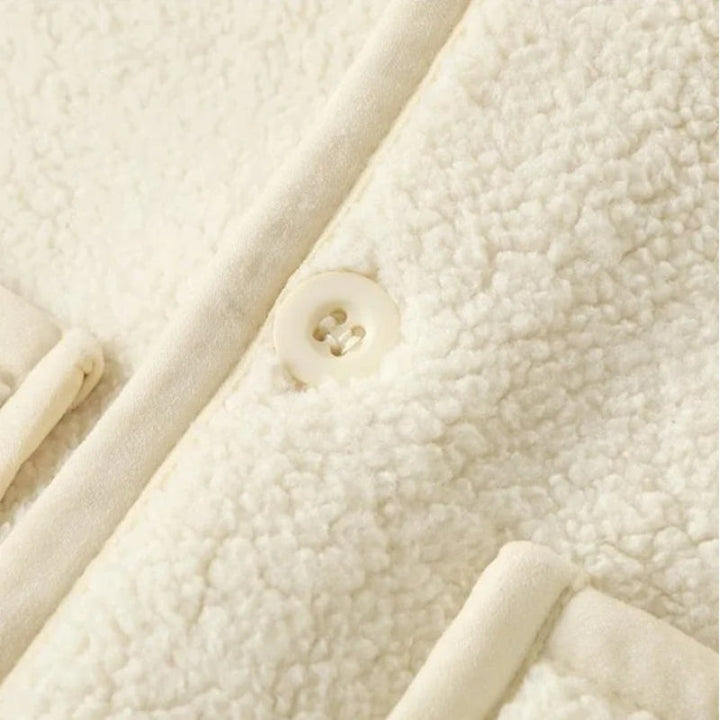 Close-up of a white fleece vest&