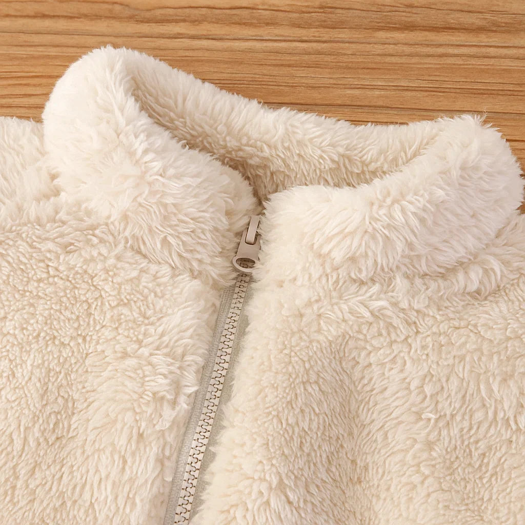 Close-up of the white fleece vest&