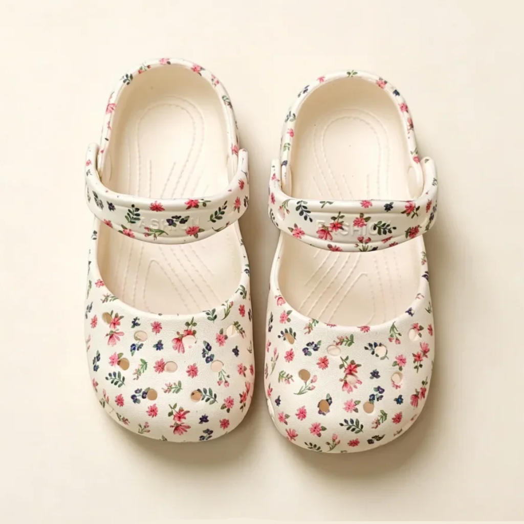White floral Mary Jane sandals viewed from above with straps across the insteps