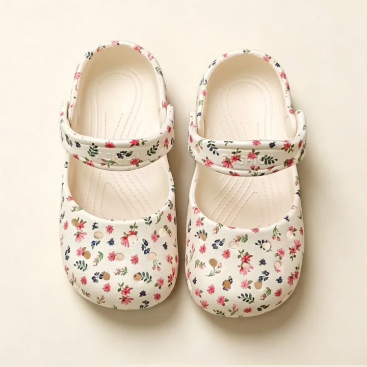 White floral Mary Jane sandals viewed from above with straps across the insteps