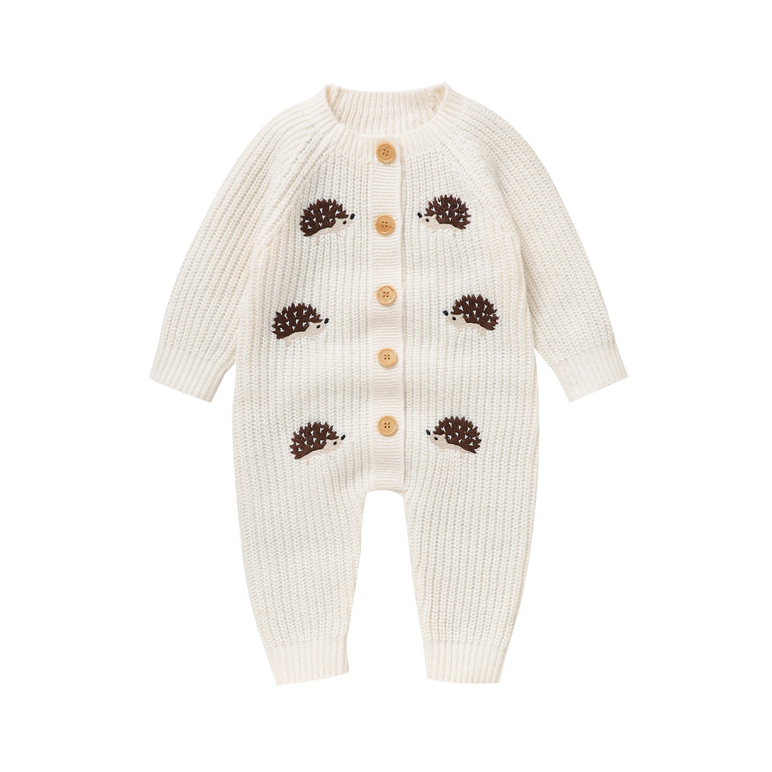 White hedgehog knit baby jumpsuit with long sleeves and front buttons.