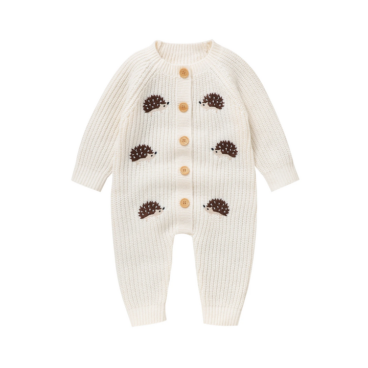 White hedgehog knit baby jumpsuit with long sleeves and front buttons.