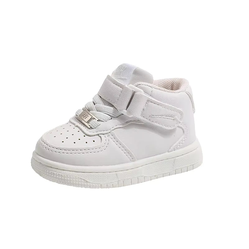 White high-top sneaker showing its hook-and-loop strap and perforated toe