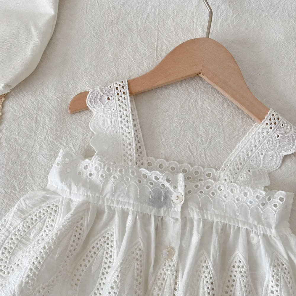 White blouse with scalloped lace straps and eyelet detailing