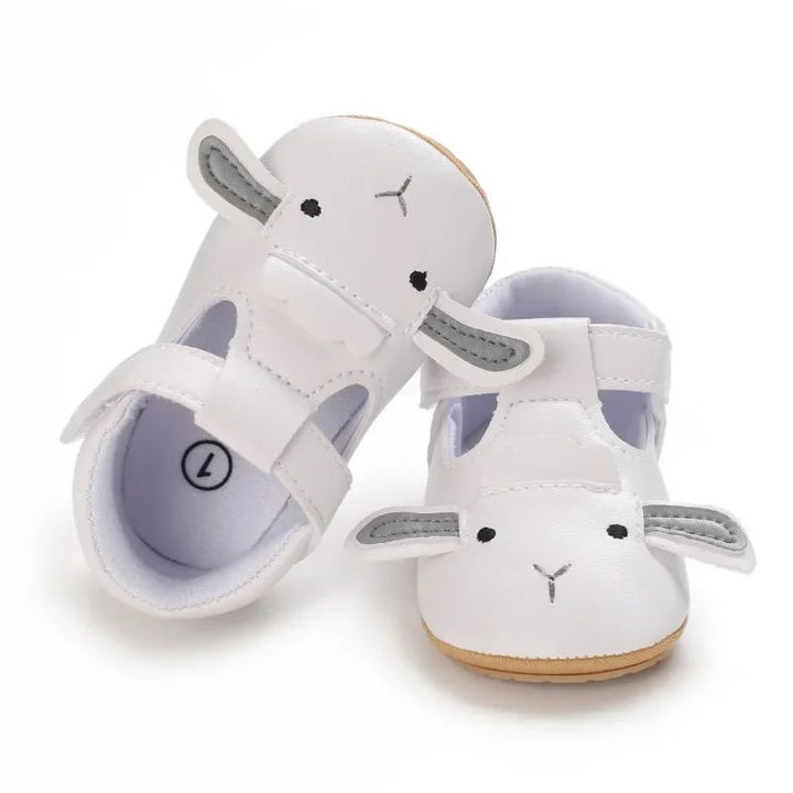White lamb-design baby shoes with gray ear accents and cutout sides