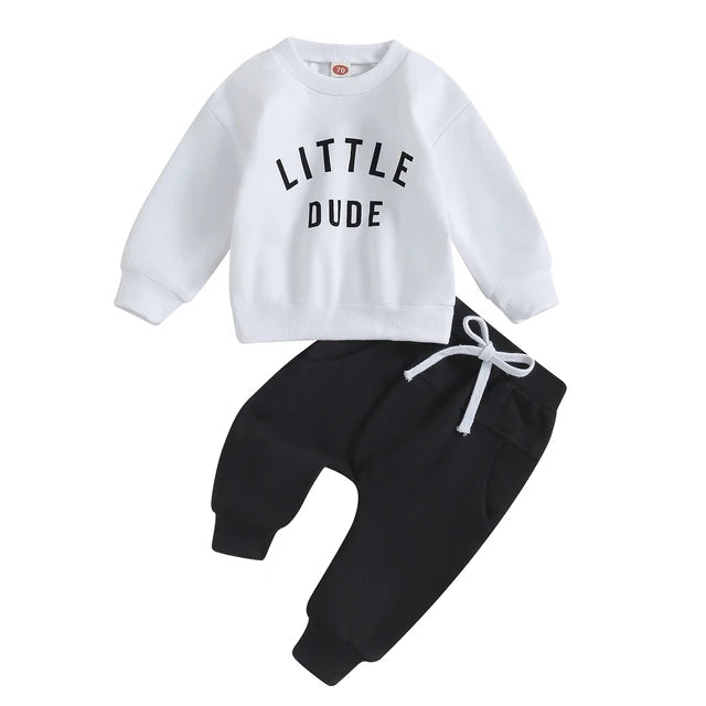 White Little Dude sweatshirt paired with black cuffed pants