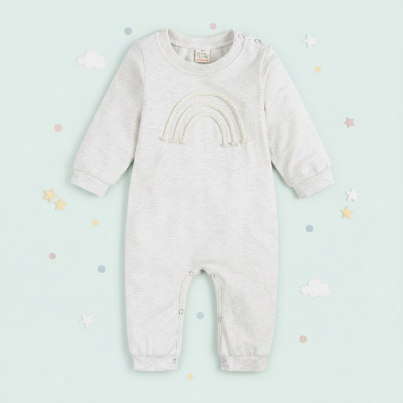 White rainbow baby romper with long sleeves and full-length legs
