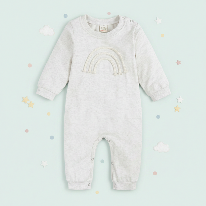 White rainbow baby romper with long sleeves and full-length legs