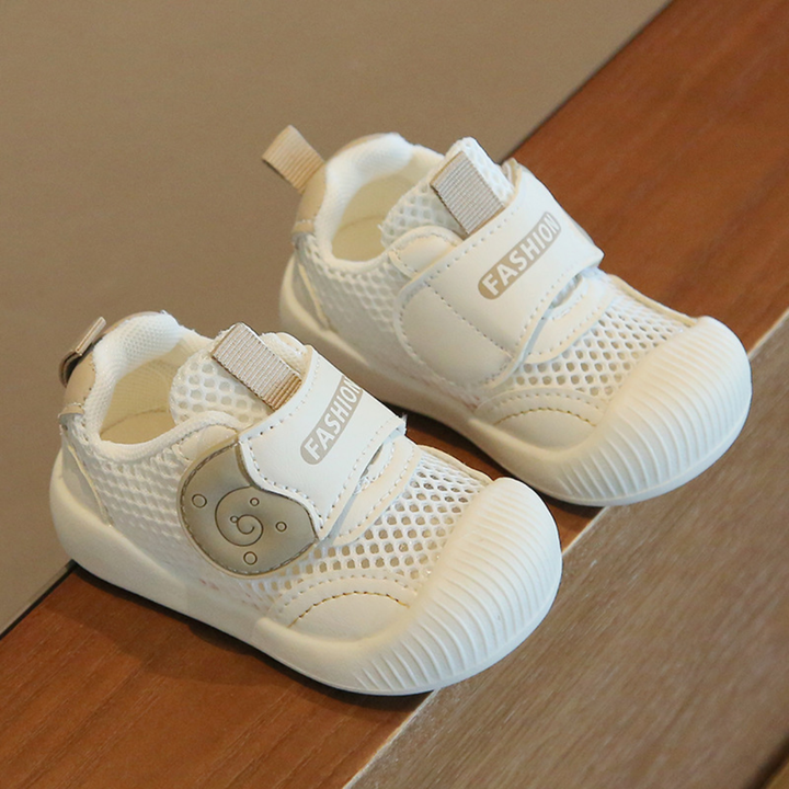 White mesh toddler sneakers with bear details and heel pull tabs