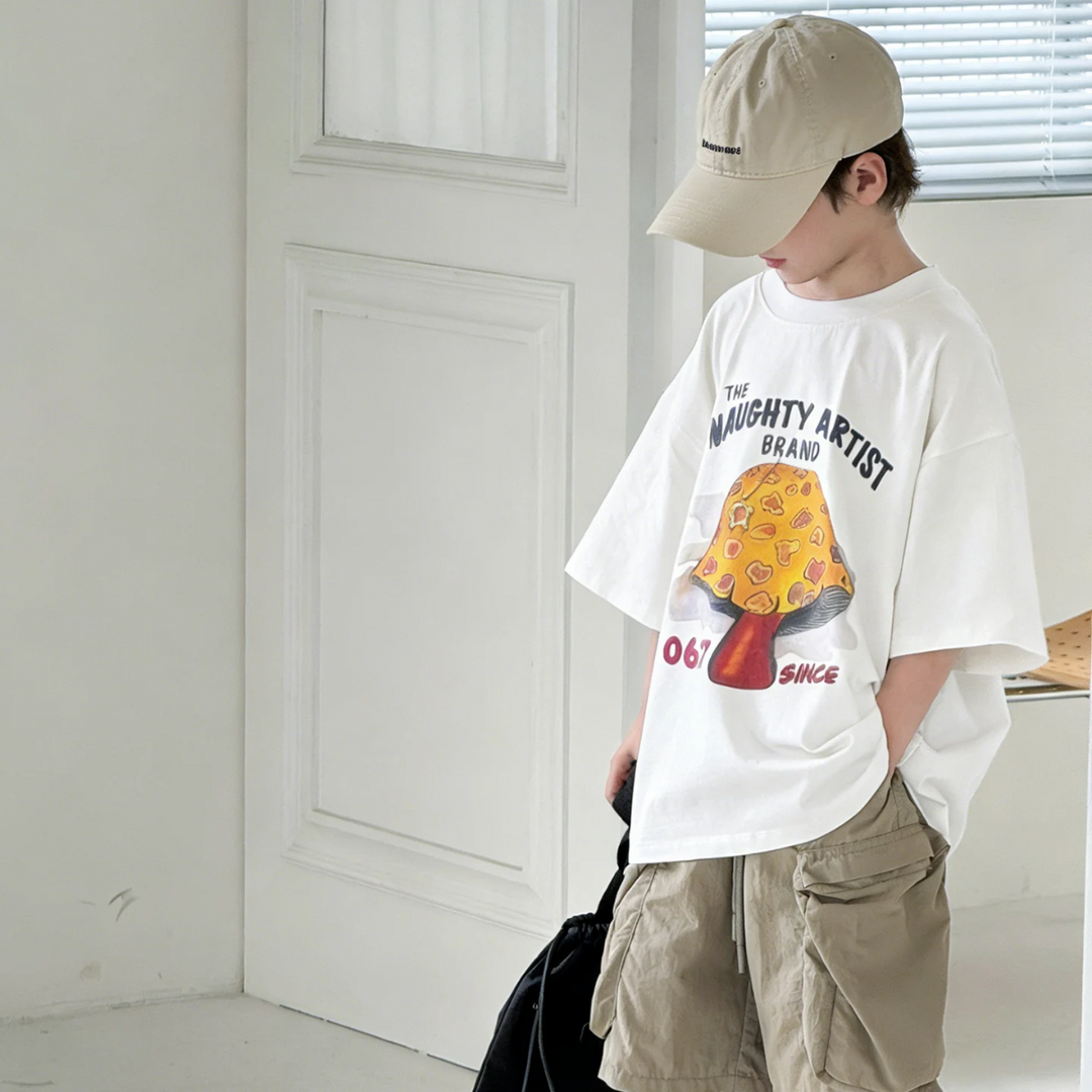 Side view of the white mushroom T-shirt showing its loose fit and wide short sleeves