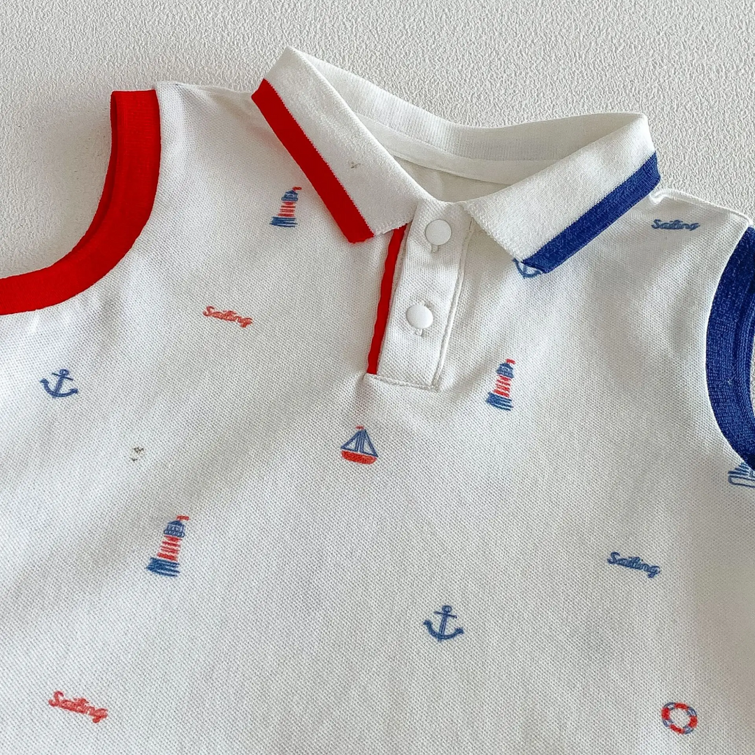 White nautical-print romper neckline with red and blue collar trim and snap fasteners