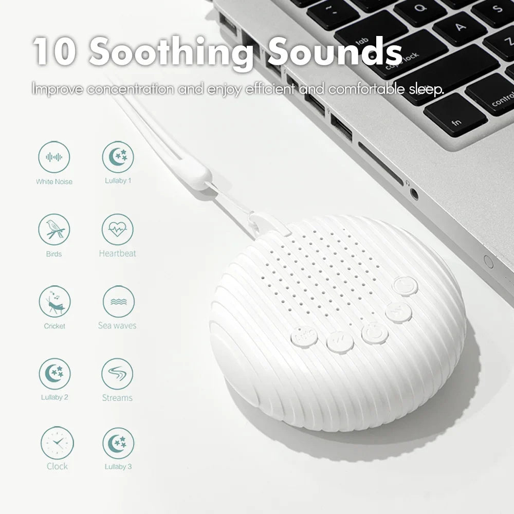 White noise machine connected to a laptop by USB beside a chart of 10 sound options