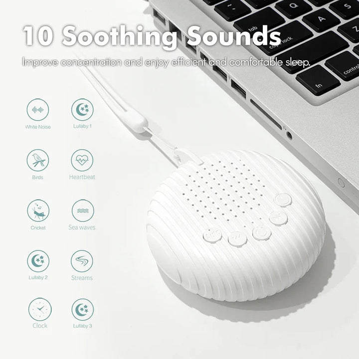 White noise machine connected to a laptop by USB beside a chart of 10 sound options