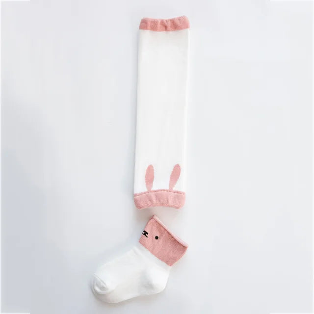 White and pink bunny-detail leg warmer with a coordinating pink-cuff baby sock.