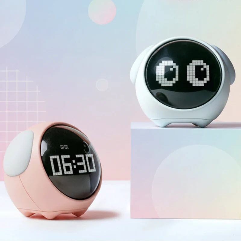 White and pink digital alarm clocks showing pixel eyes and the time