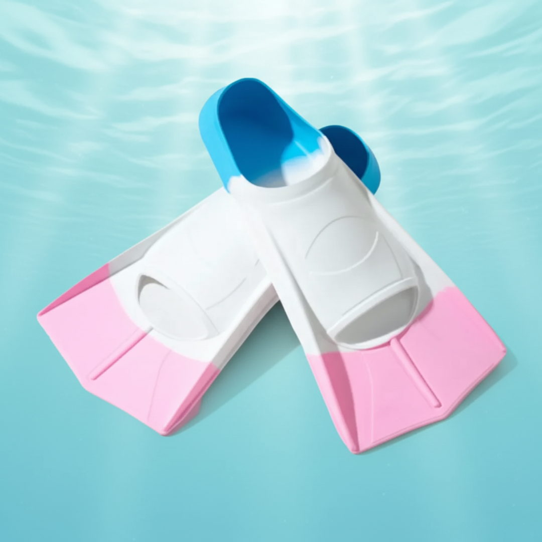 White swim fins with pink blades and blue heel sections against a pool-water background.