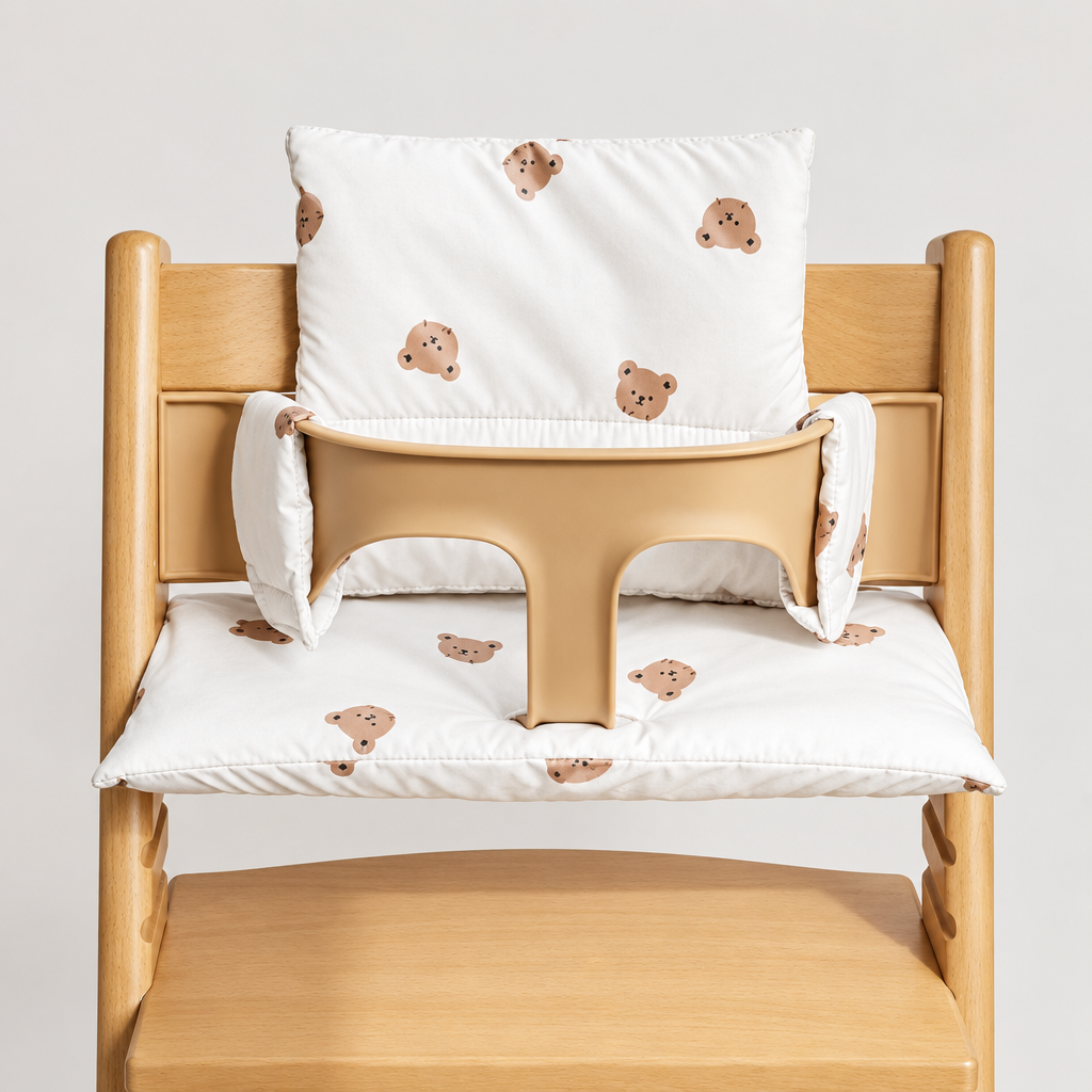 White rabbit-print high chair cushion shown with matching seat and backrest padding