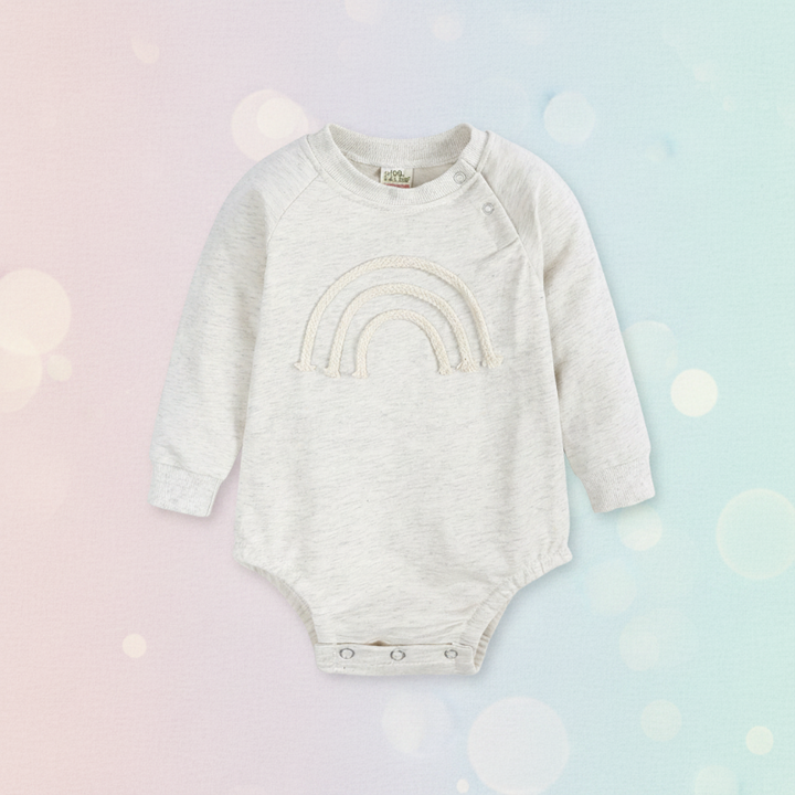 White long-sleeve baby bodysuit with a raised rainbow and bottom snaps