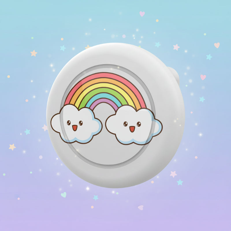 White AirTag brooch case with a rainbow and two smiling clouds