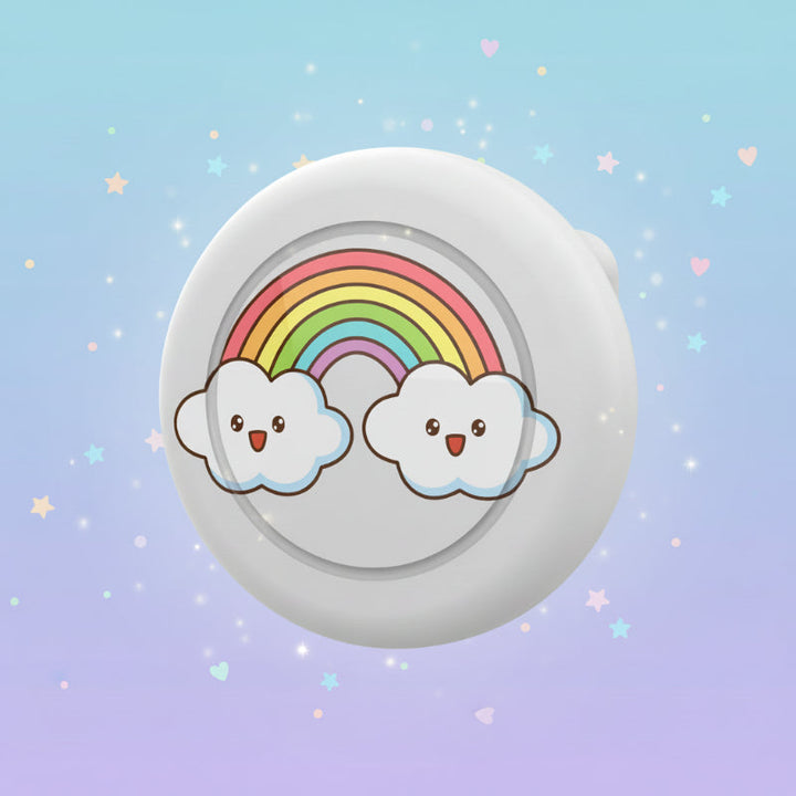 White AirTag brooch case with a rainbow and two smiling clouds