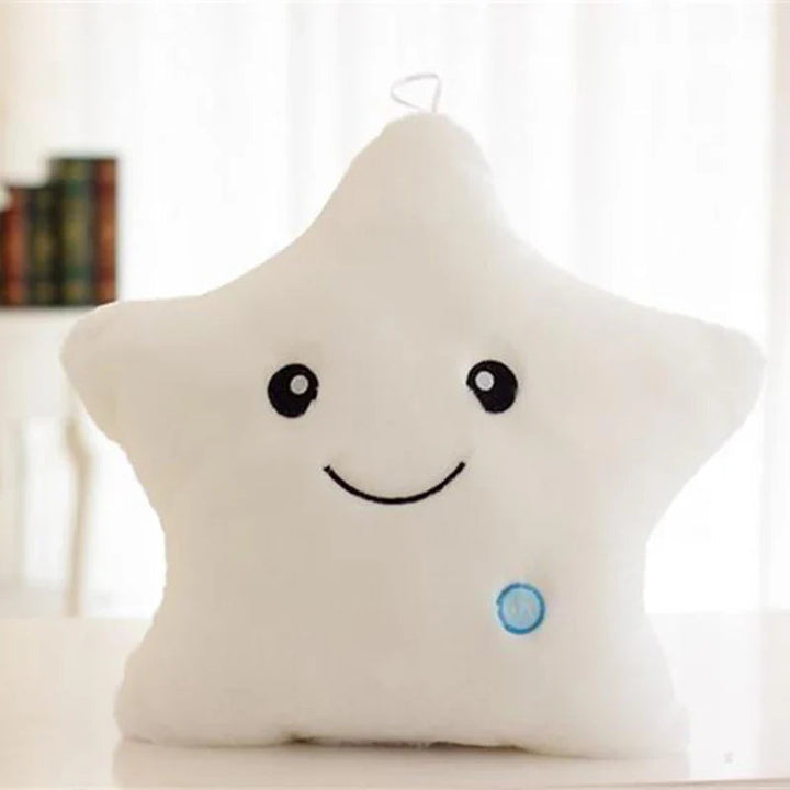 White plush star pillow with a smiling face and blue button