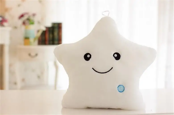 White star-shaped plush pillow with a smiling face and small hanging loop