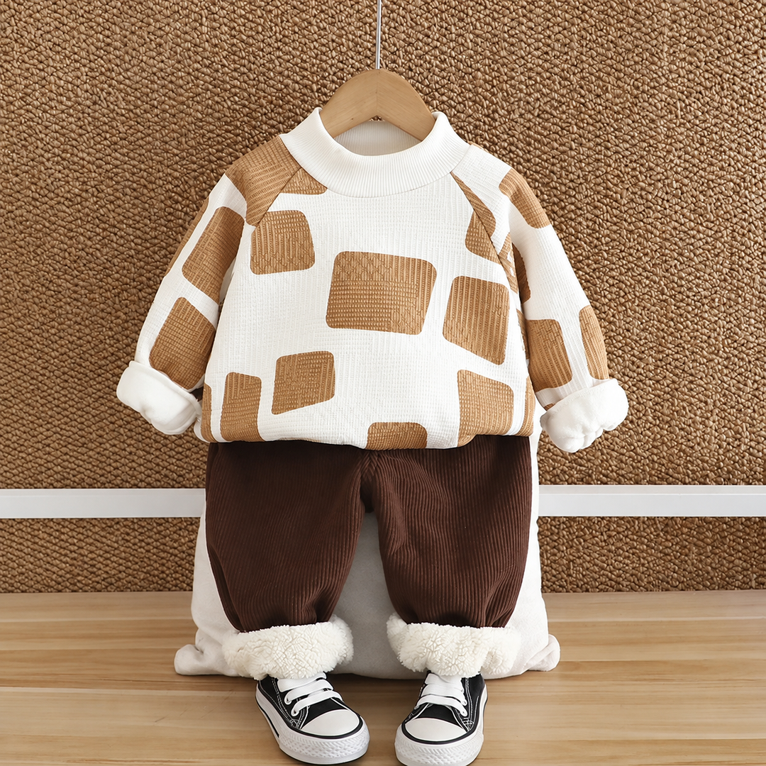 White sweater with tan blocks and brown pants, shown with turned-up fleece cuffs