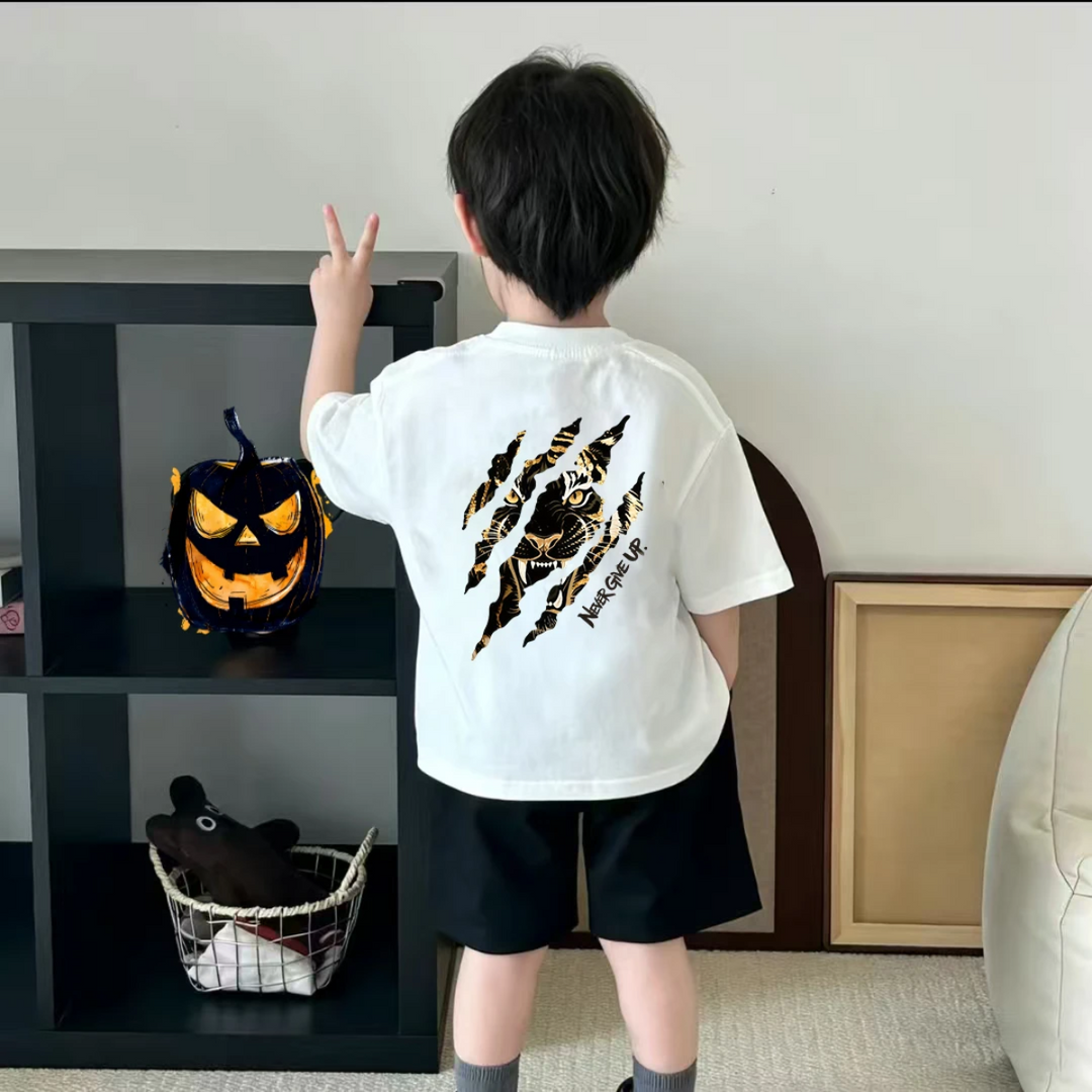 Child wearing the white tiger-print T-shirt, viewed from the back.