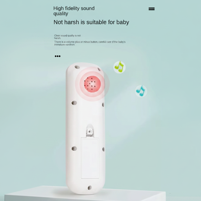 Back of a white toy remote showing its speaker and battery compartment