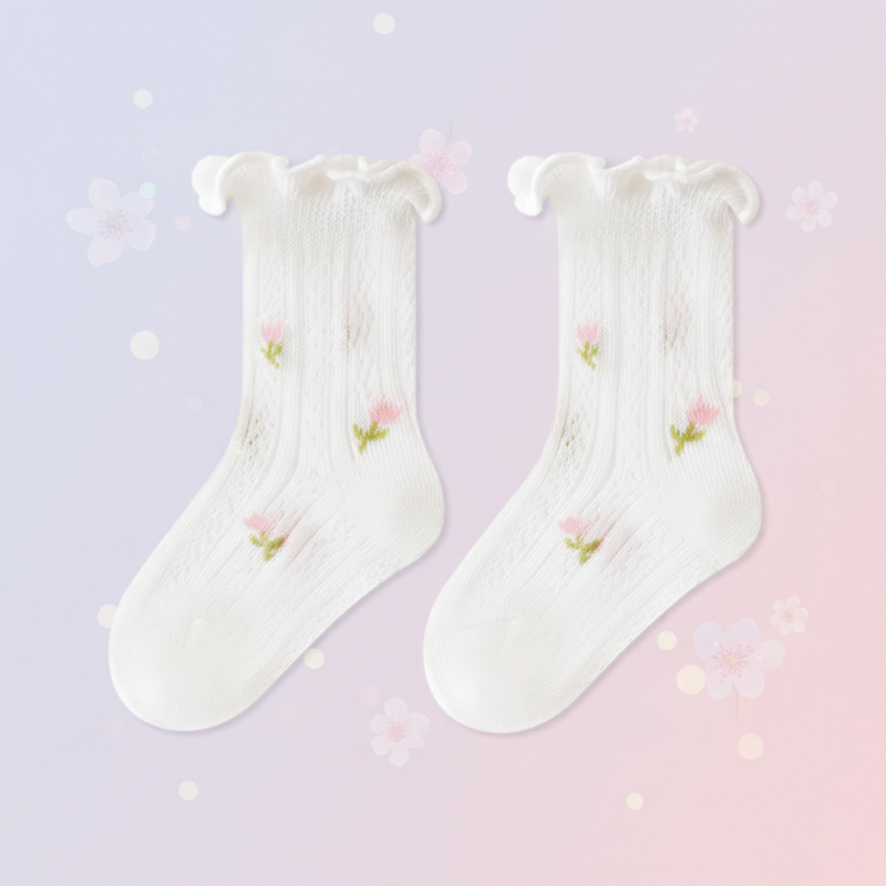 Pair of white baby socks with small tulip details and ruffled cuffs.