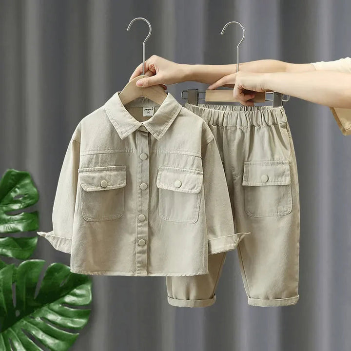 White two-piece cotton denim set with flap chest pockets and matching pants
