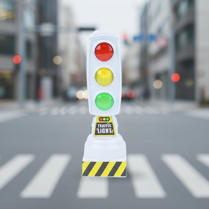 White upright traffic-light toy with three colored lenses and a striped base.