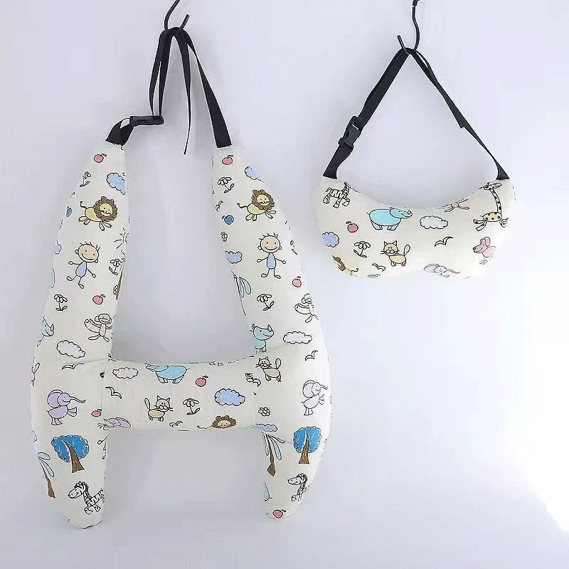 White zoo-animal-print H-shaped car pillow and matching neck pillow with black straps