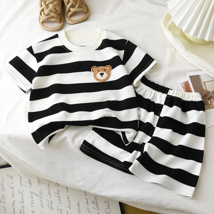 Wide black-and-white striped T-shirt with a bear chest patch and matching shorts.