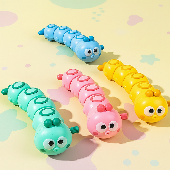 Blue, pink, mint green, and yellow wind-up caterpillar toys on a patterned play mat