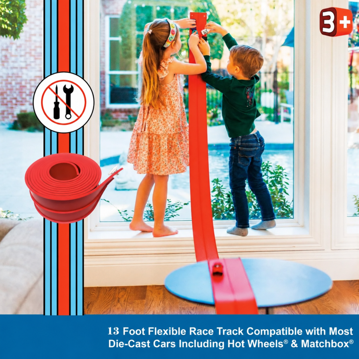 Two children setting up a red race track against a glass door.