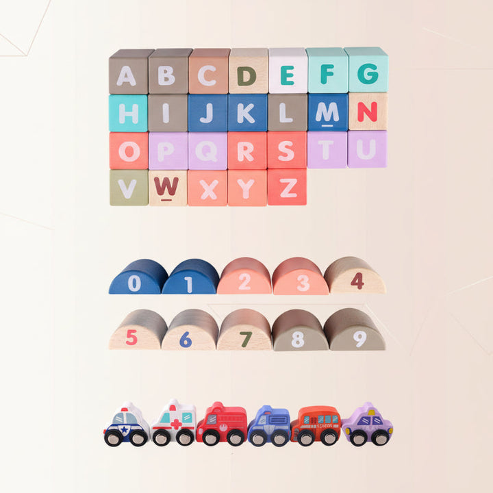 Wooden alphabet blocks, numbered semicircles, and toy vehicles arranged in rows