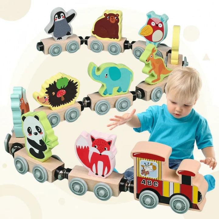 Child in a blue shirt reaching toward a wooden train with magnetic animal cars