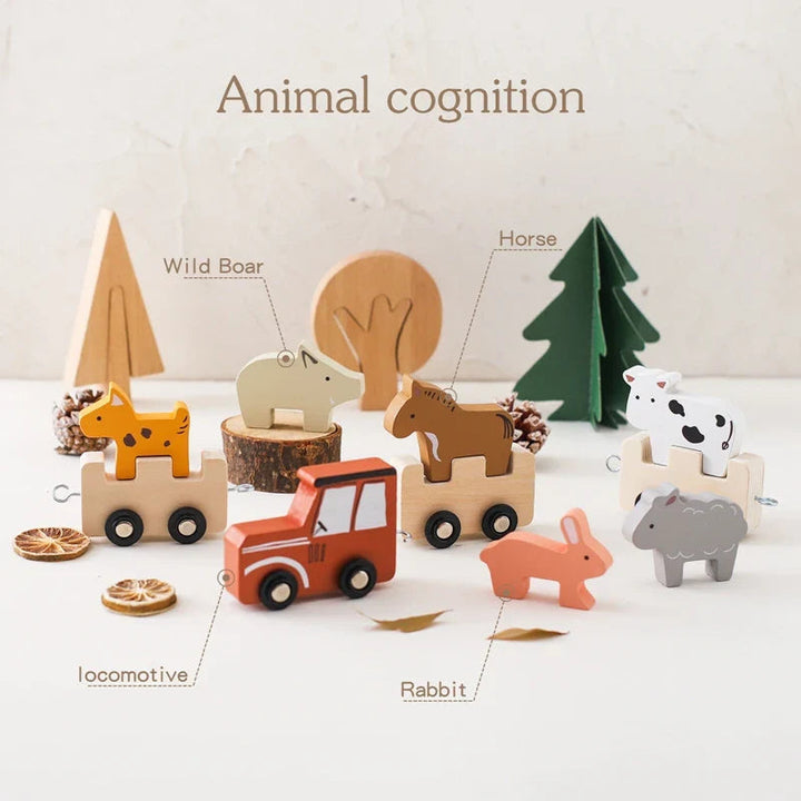 Red wooden engine and animal cars displayed with loose animal figures.