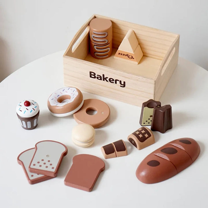 Wooden bakery play food with bread, doughnuts, pastries, and a storage crate