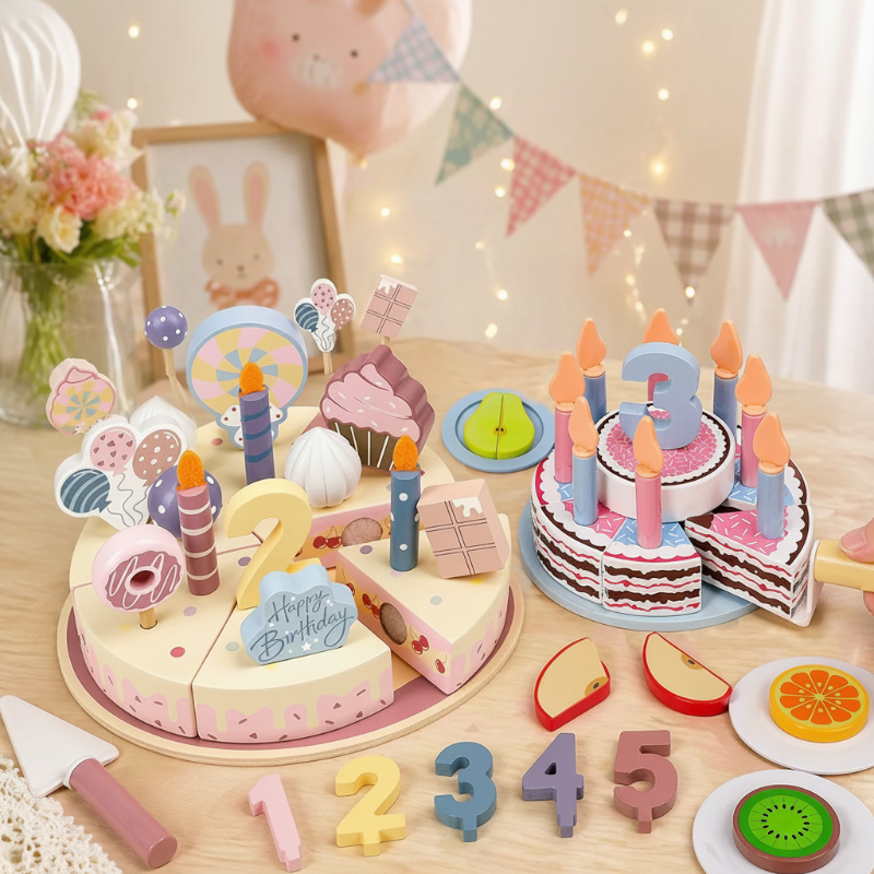 Two decorated wooden birthday cakes displayed with number pieces, candles, and toy fruit